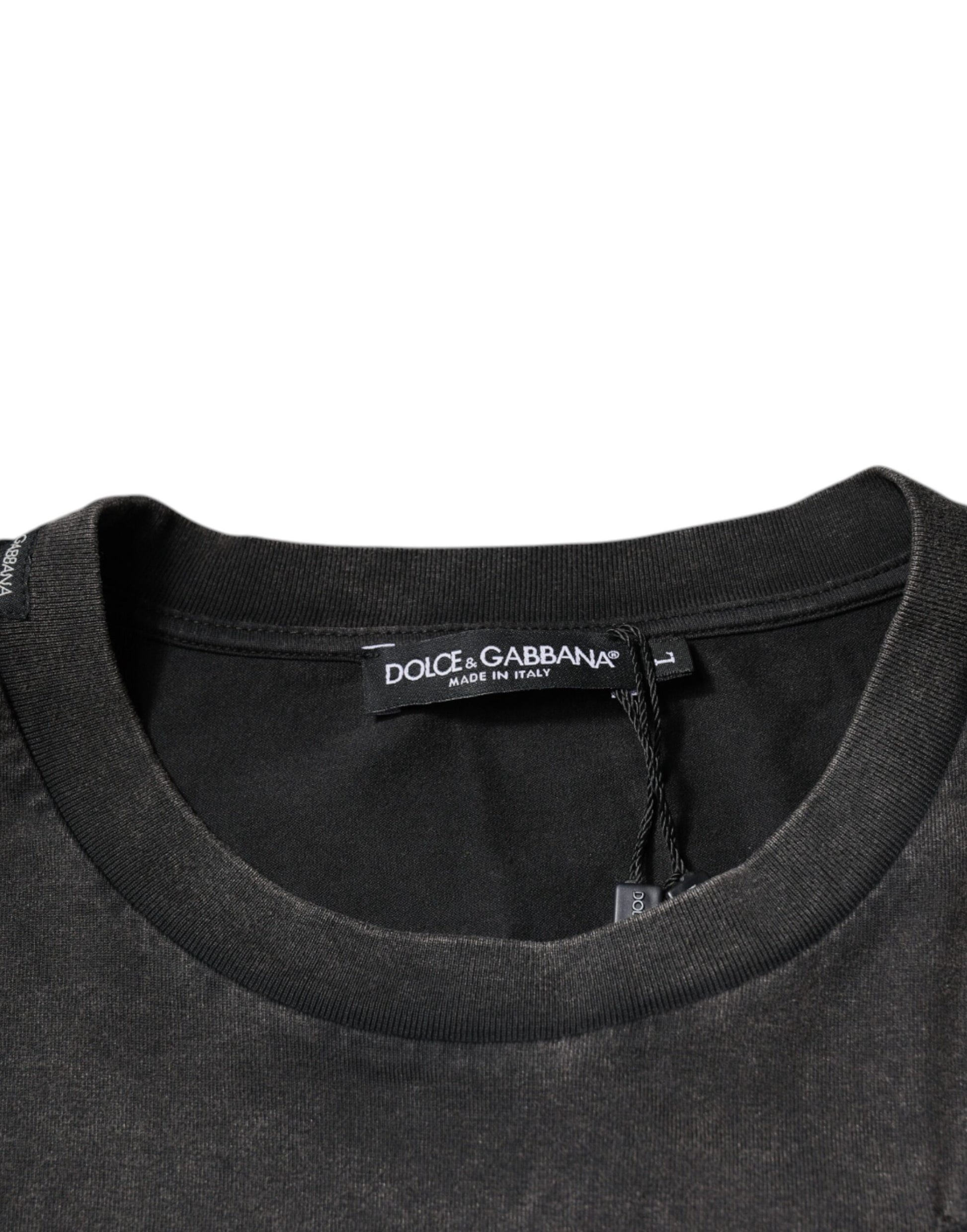 Black sweater on hanger with tag