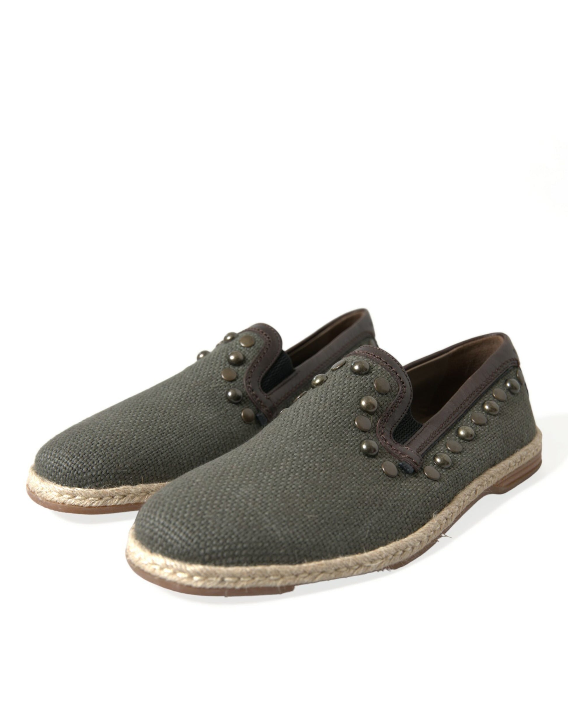 Pair of brown shoes with tan soles and gold buttons