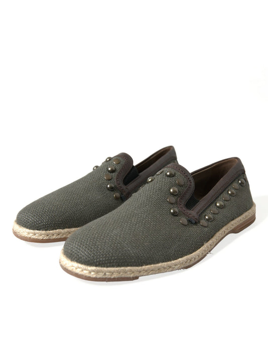 Pair of brown shoes with tan soles and gold buttons