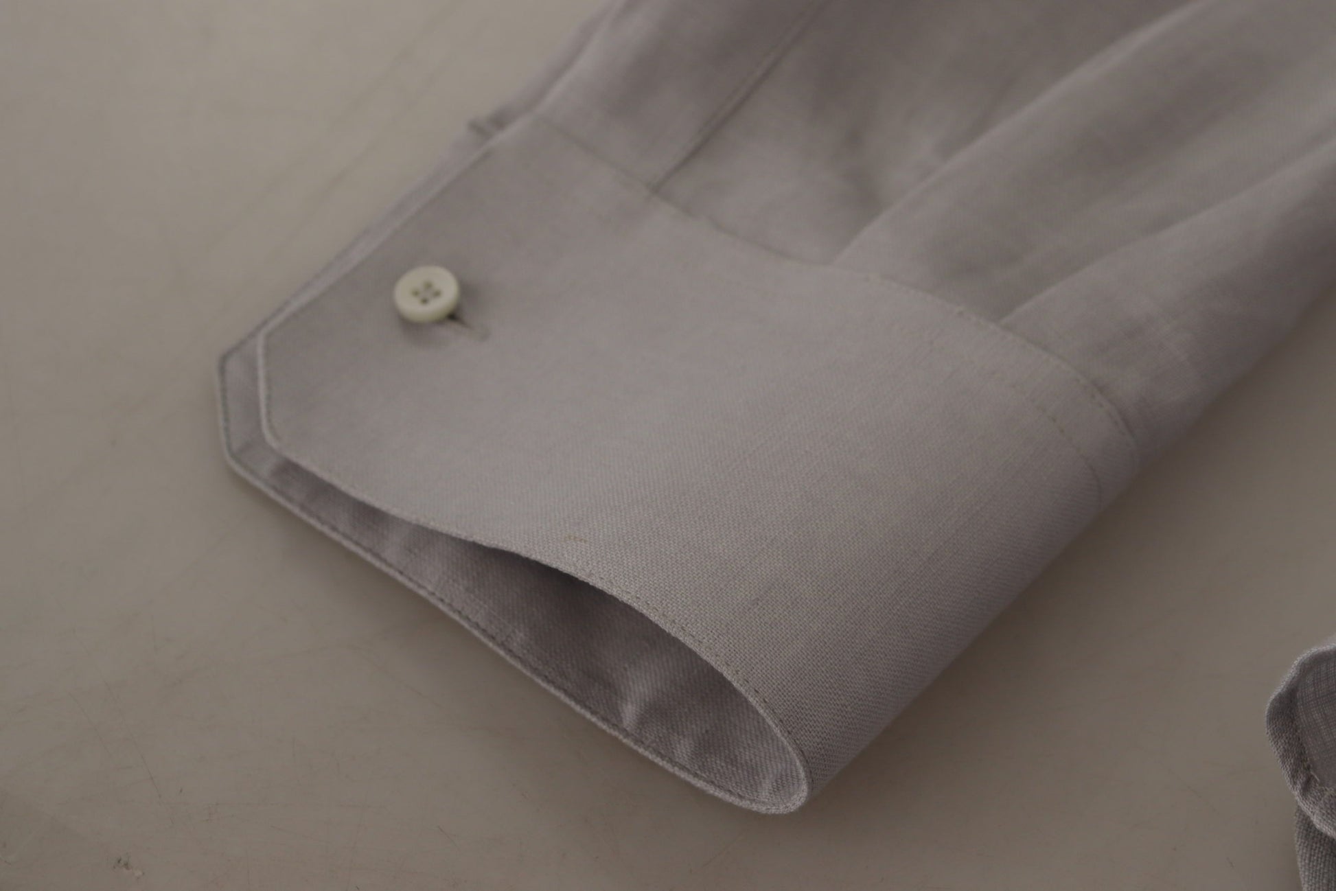 Grey dress shirt with buttoned cuffs