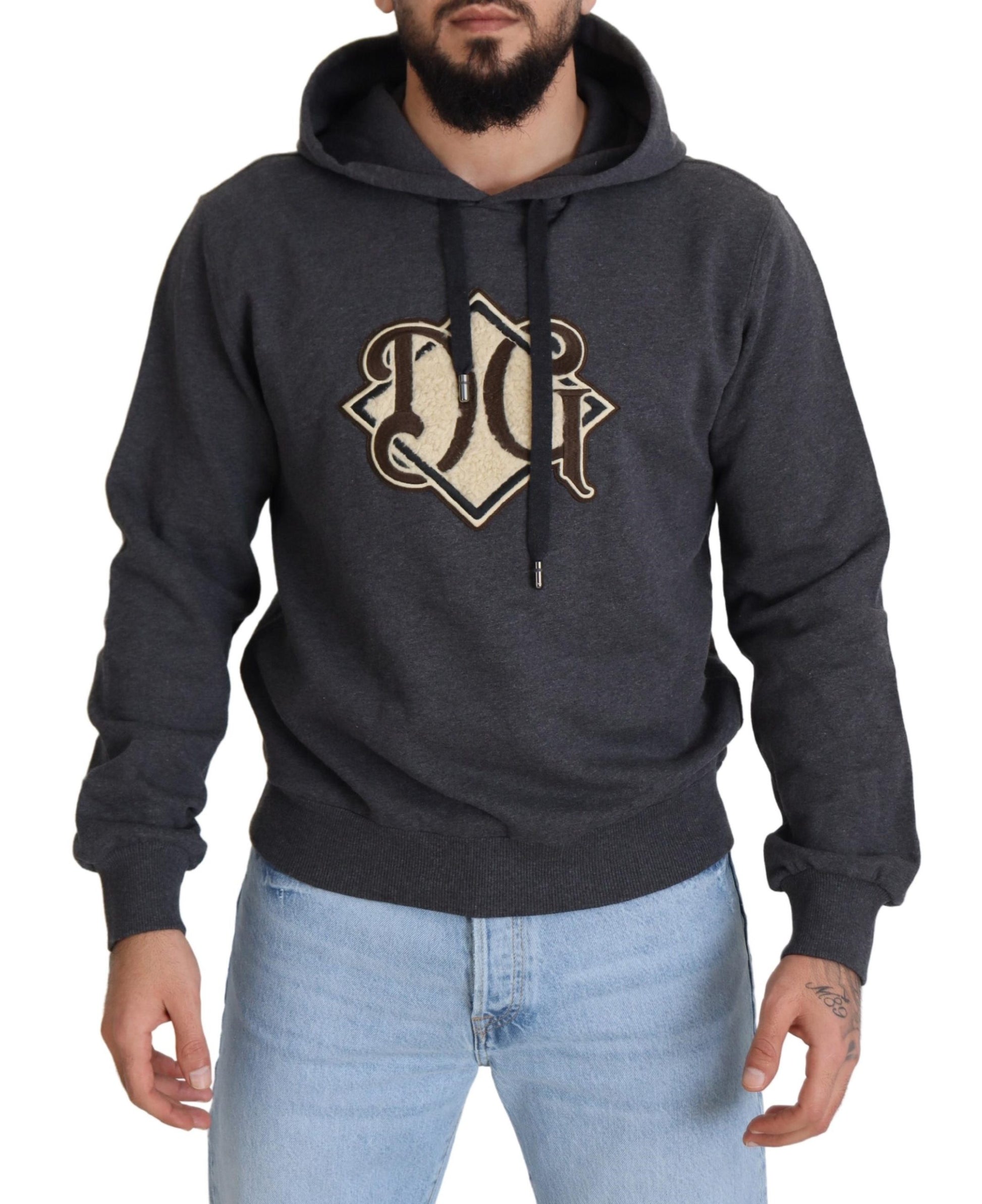 Man wearing gray hoodie with logo on front
