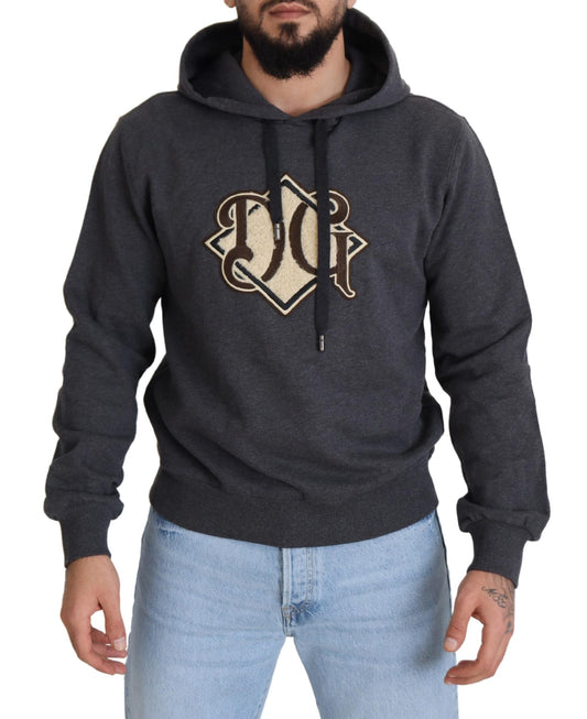 Man wearing gray hoodie with logo on front