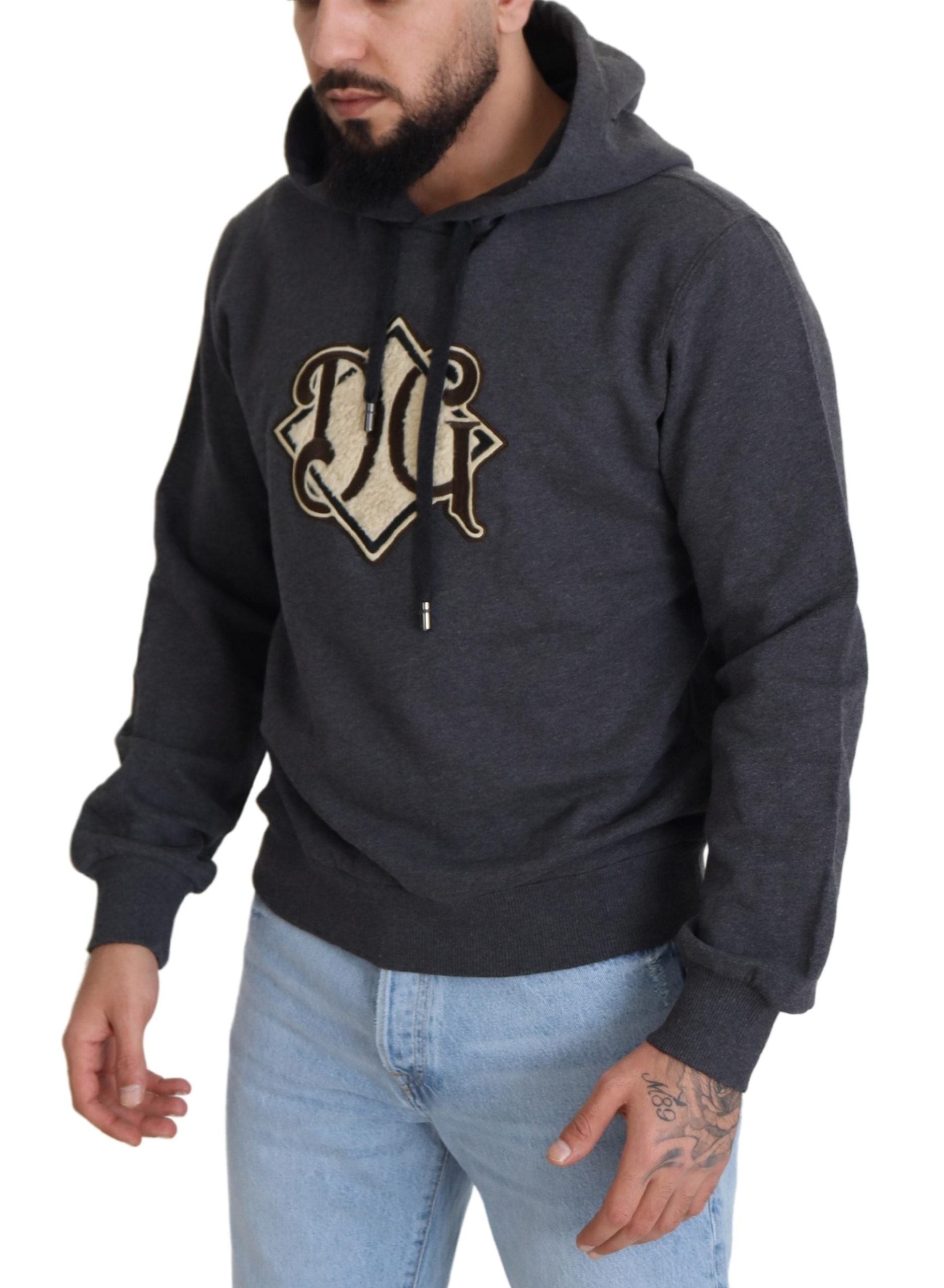 Man wearing gray hoodie with white logo
