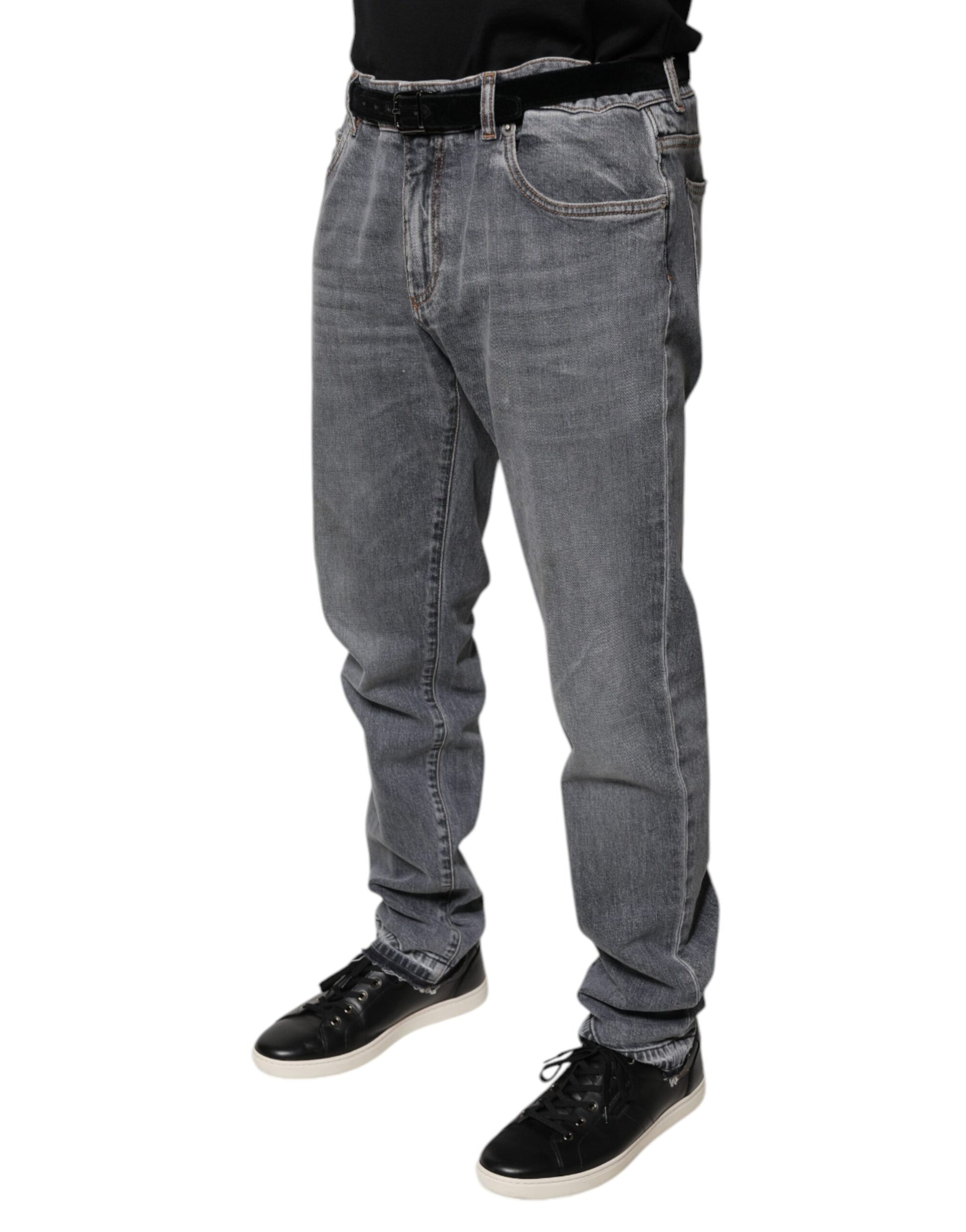 Man wearing blue jeans and black shoes