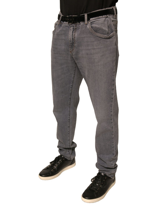 Man wearing blue jeans and black shoes