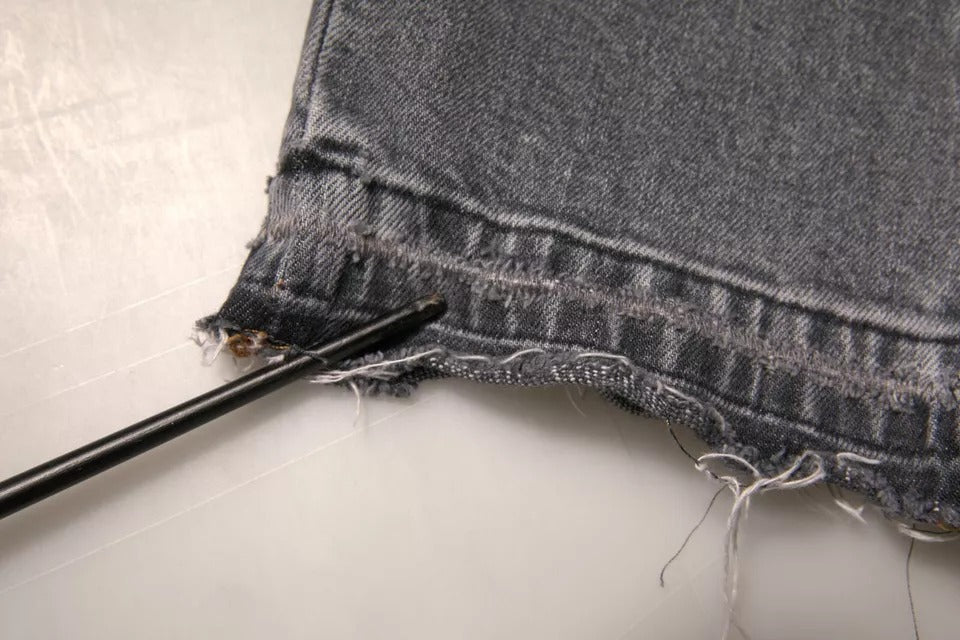 Denim jeans with holes in knees