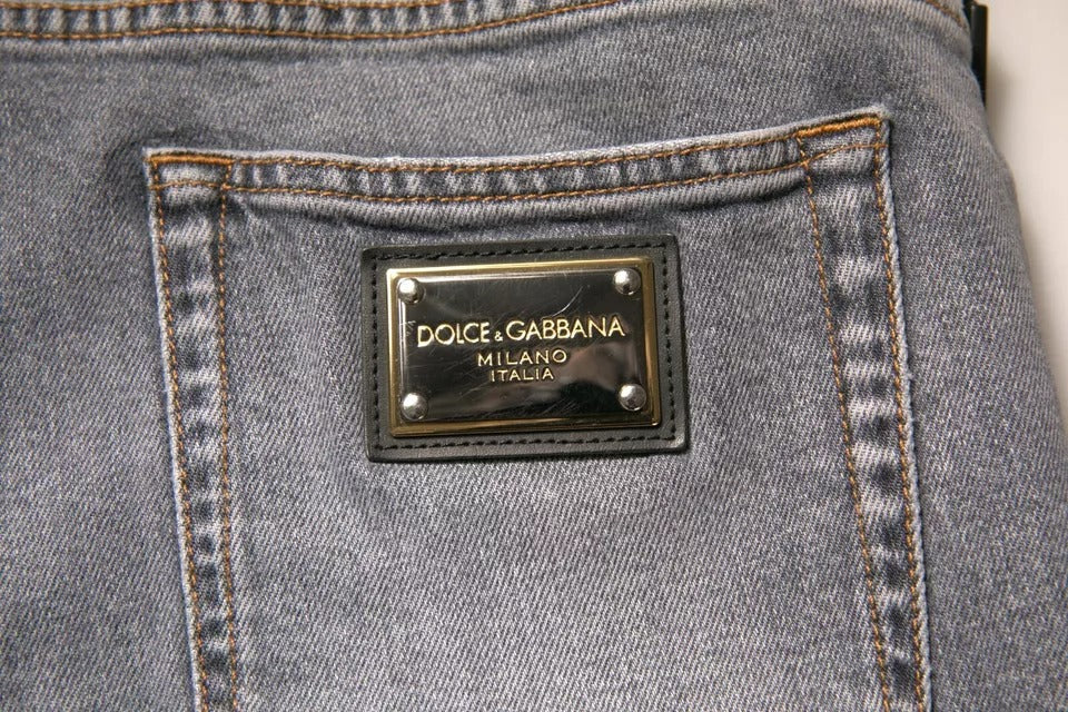 Blue jeans with a designer label on the back pocket