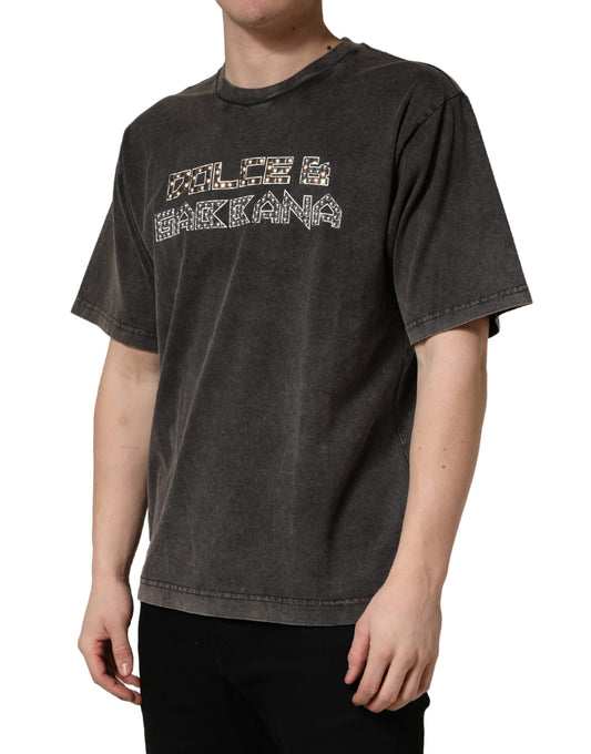 Man wearing gray t-shirt with white lettering