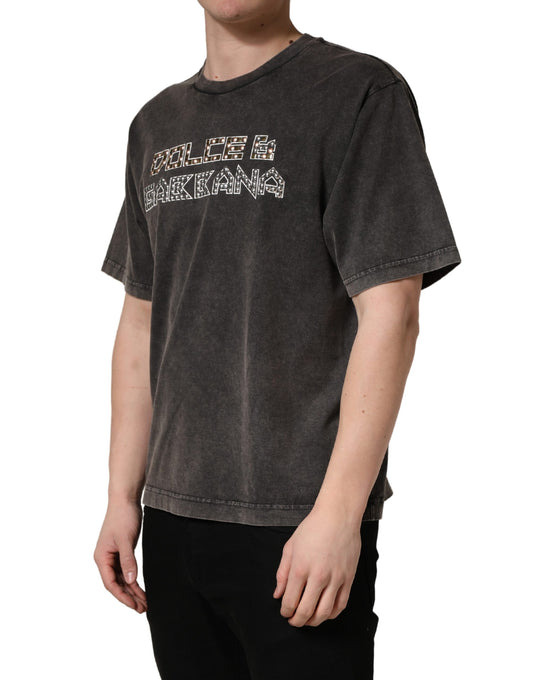 Man wearing gray t-shirt with white lettering