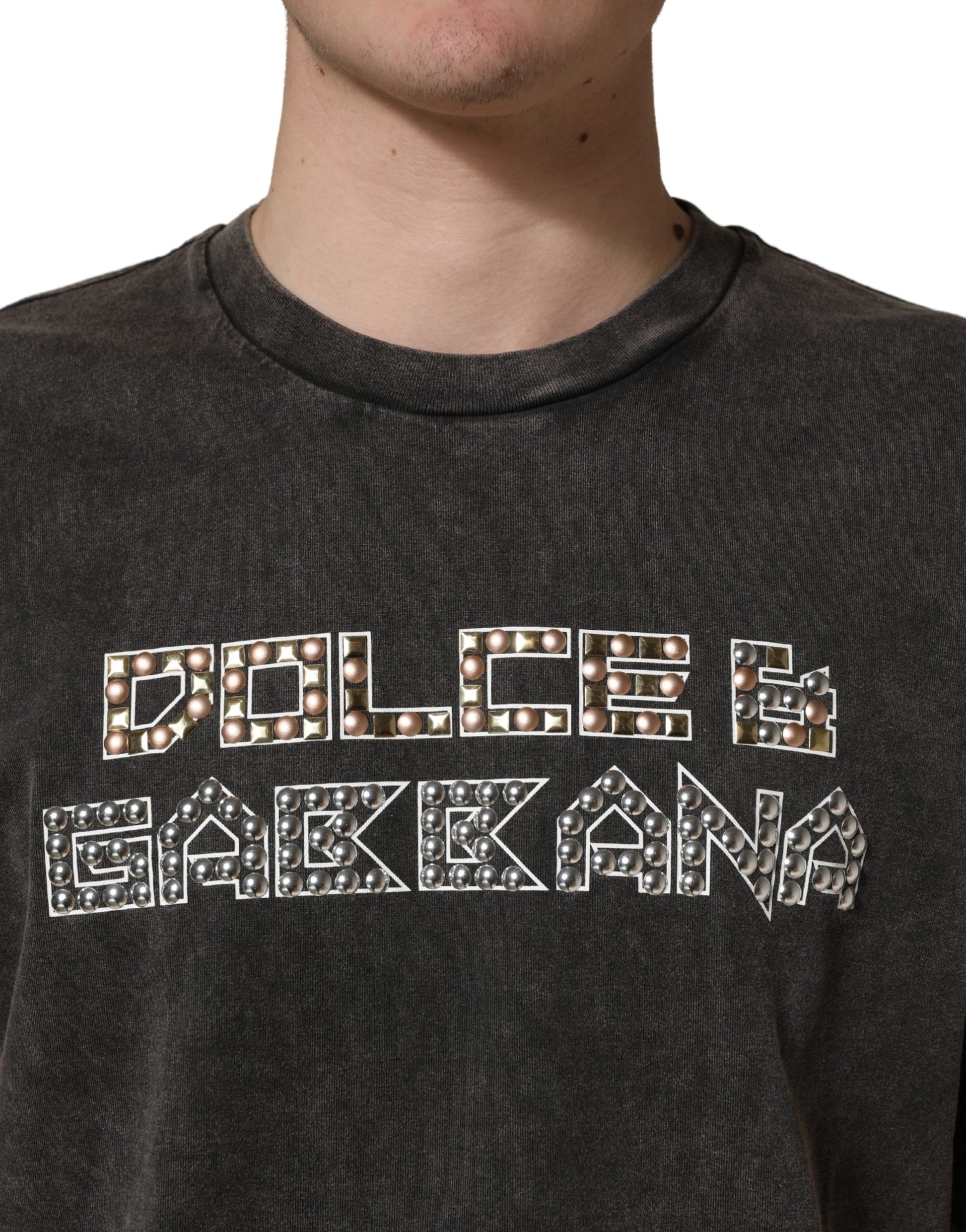 Man wearing dark shirt with embroidered logo