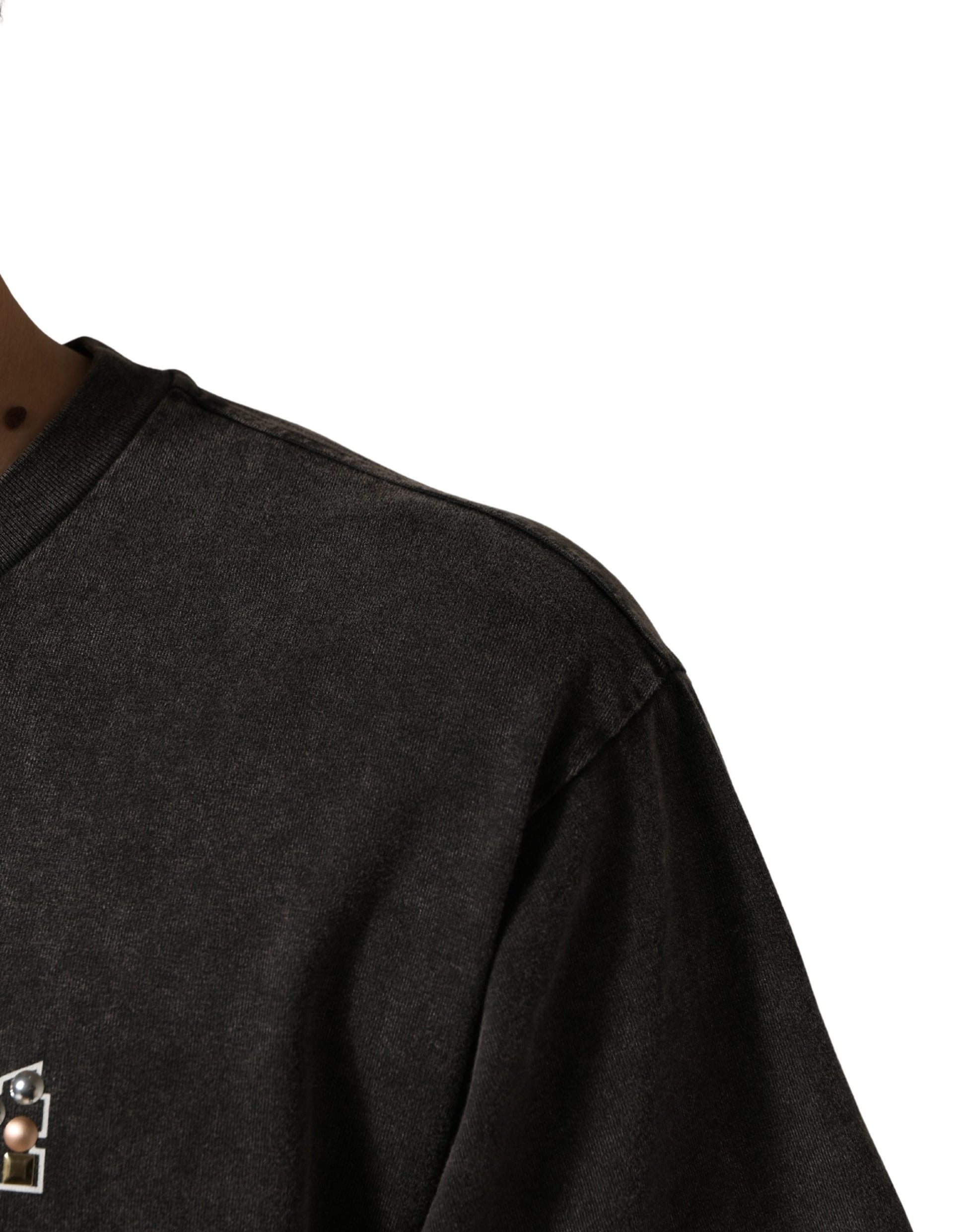 Black long sleeve shirt with a small emblem on the left chest area