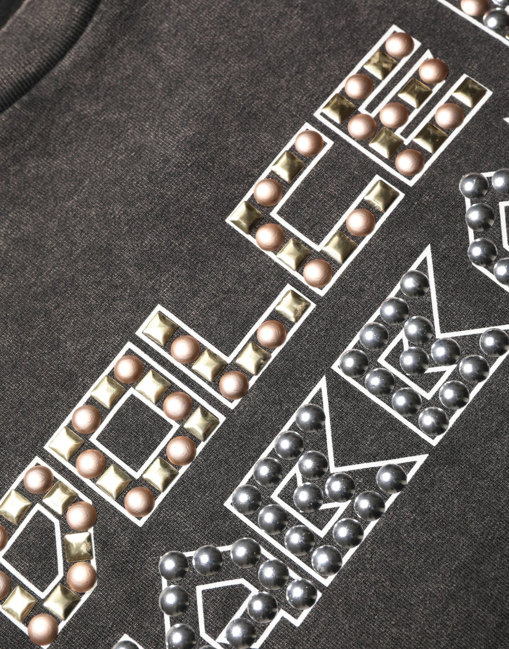 Black shirt with embroidered words and beads