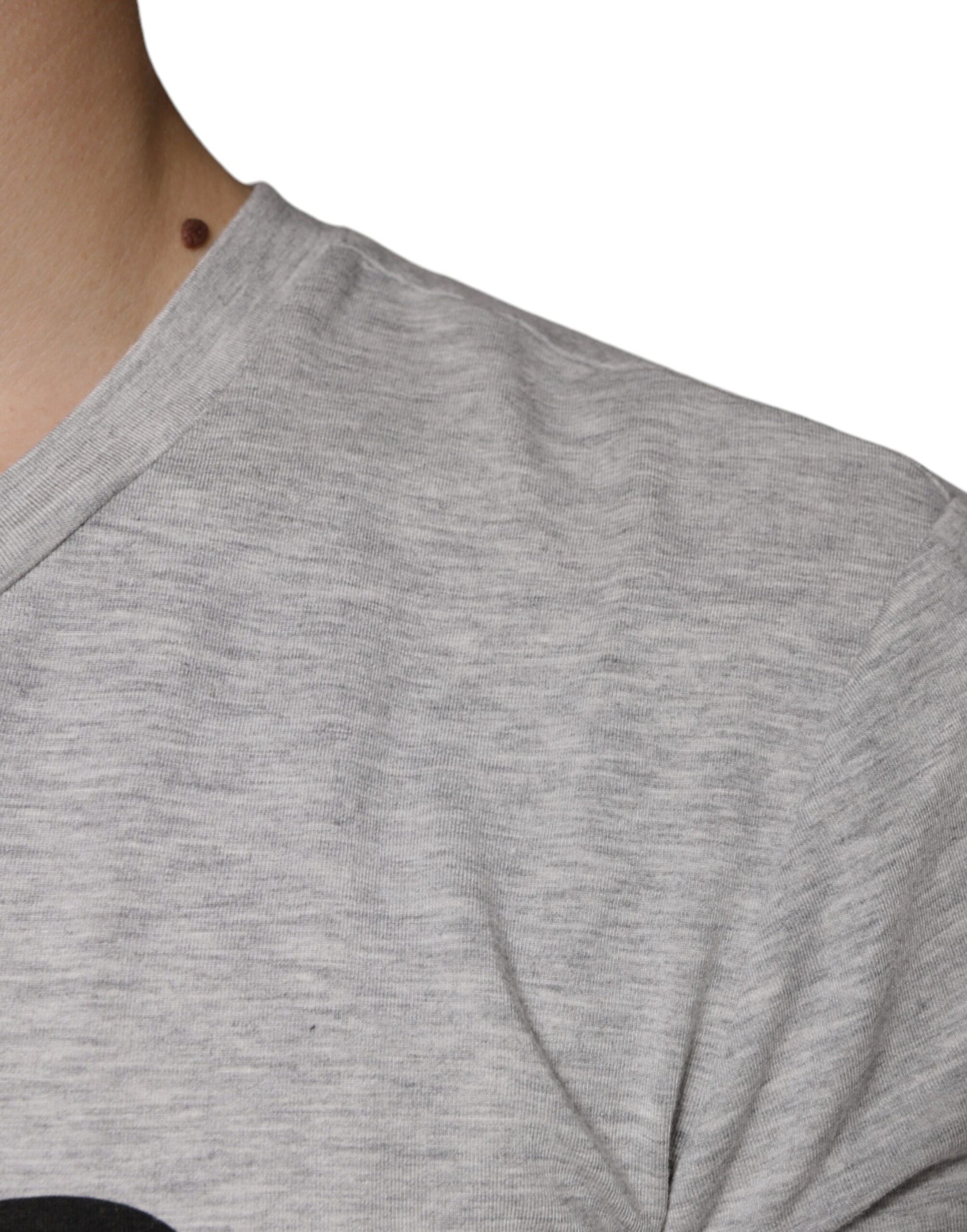 Grey cotton t-shirt on man's shoulder