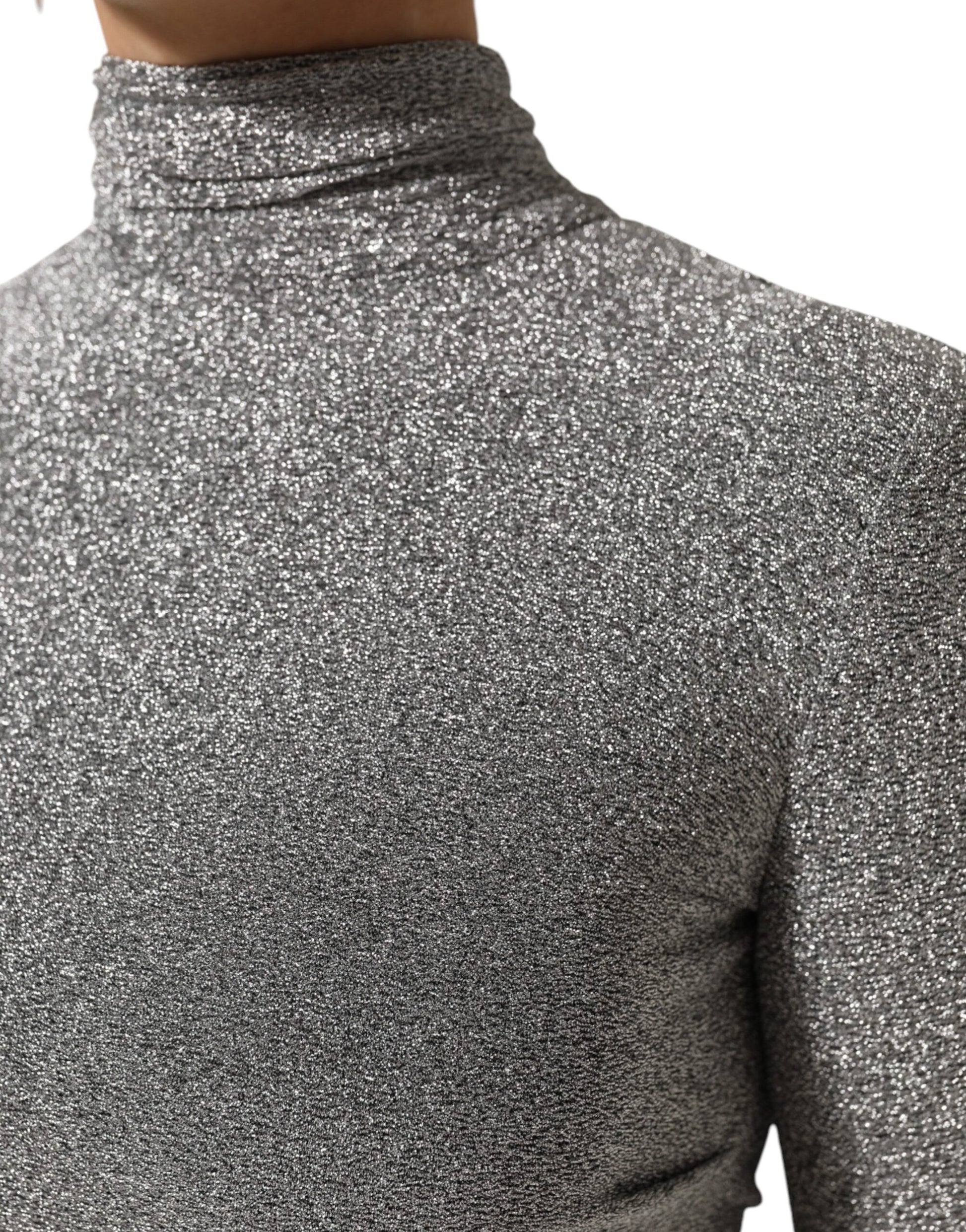 A gray nylon bodycon sheath dress with long sleeves