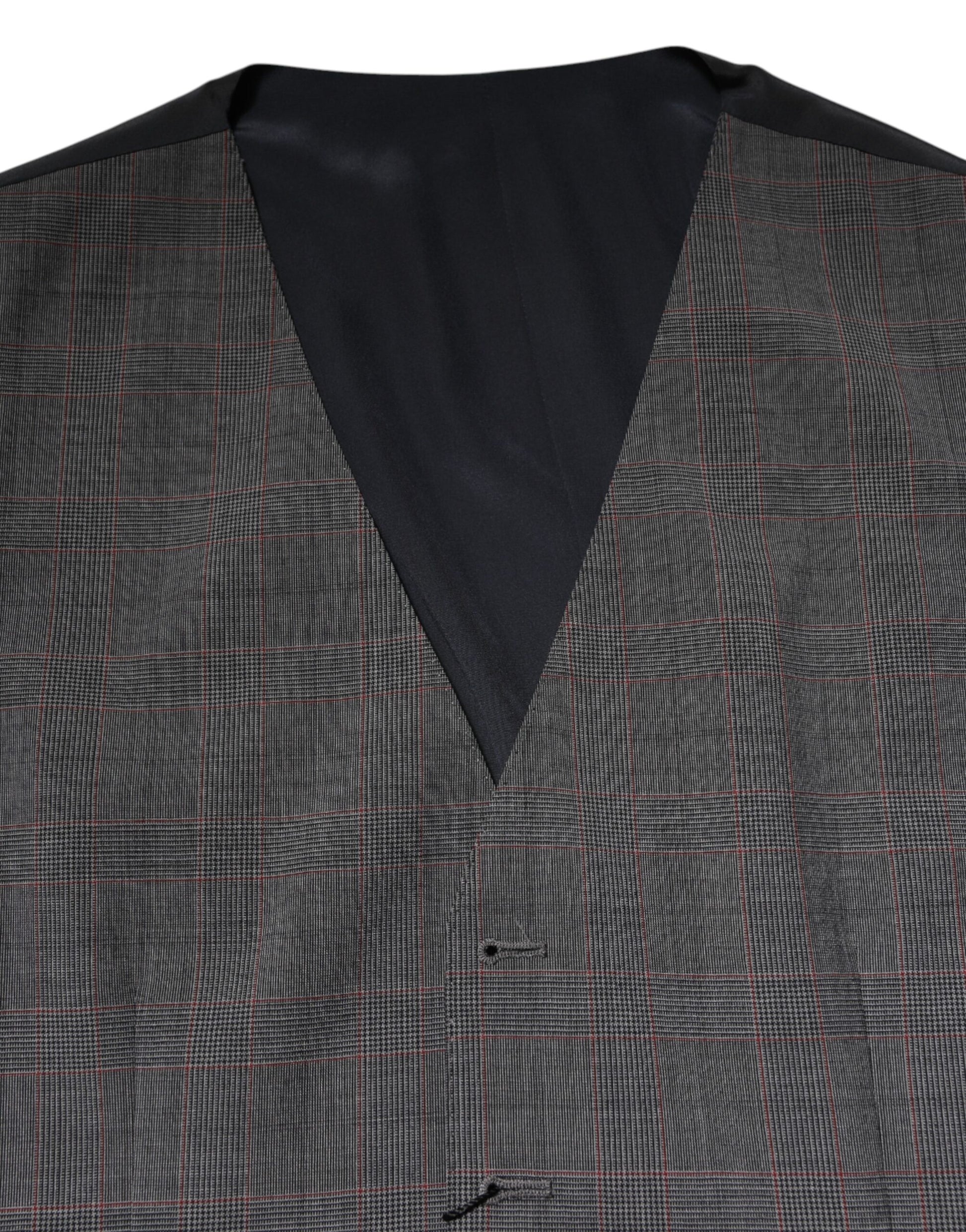 A gray plaid wool vest with a black shirt underneath