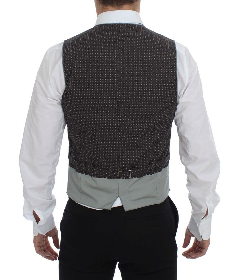 A gray vest with polka dots, part of a suit or tailored outfit