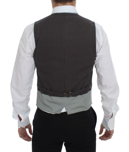 A gray vest with polka dots, part of a suit or tailored outfit