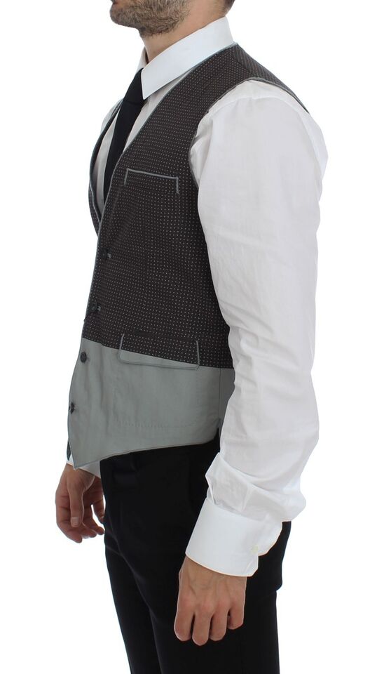 A gray vest with polka dots, part of a suit ensemble