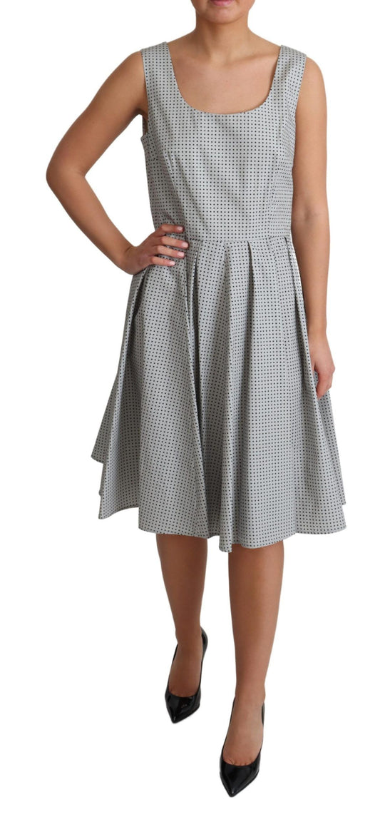 A gray polka dotted cotton dress with an A-line silhouette