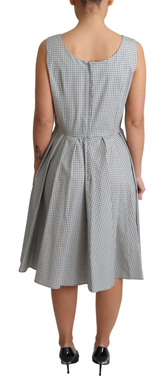 A gray polka dotted cotton dress with an A-line silhouette