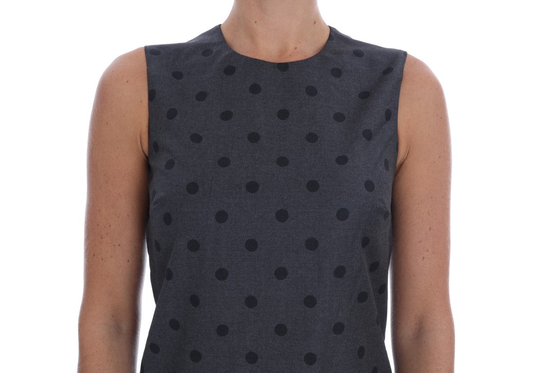 A gray polka dotted sheath wool dress with short sleeves