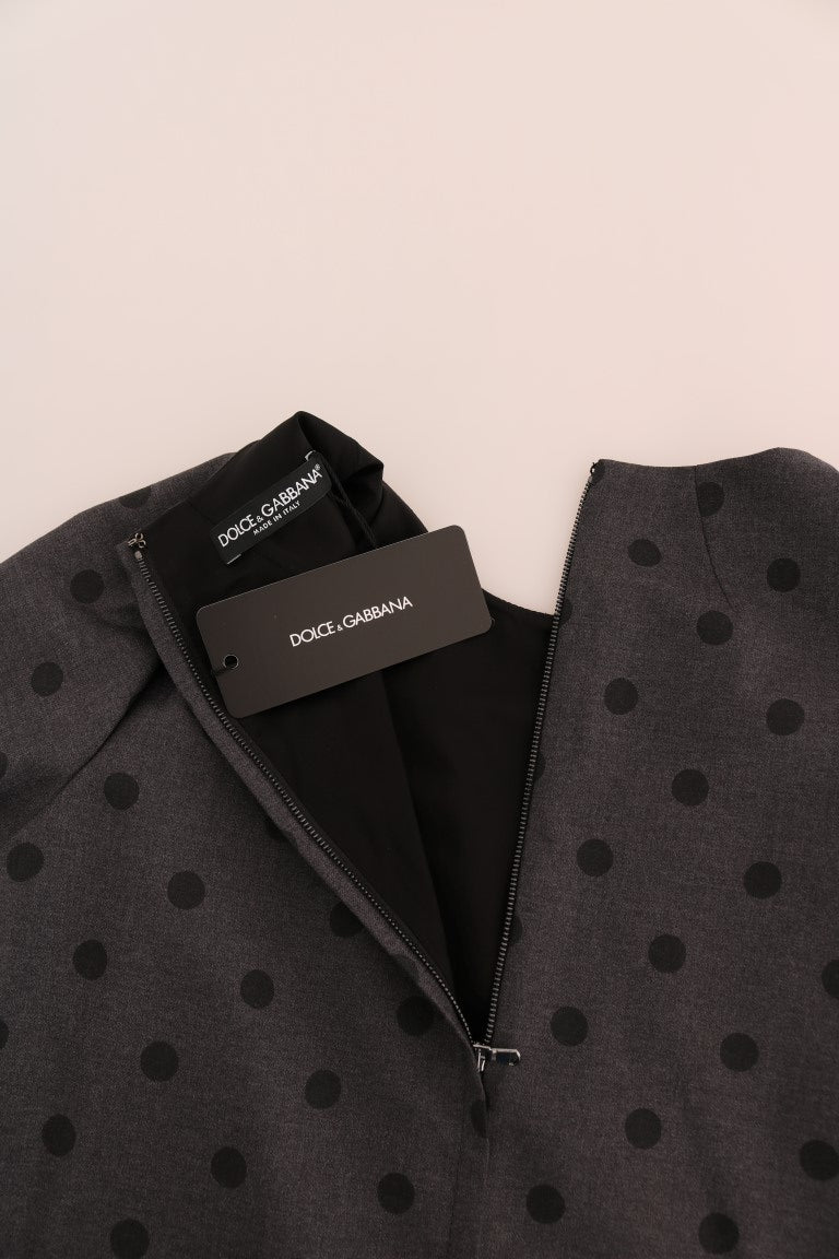 A gray polka dotted sheath dress from Dolce & Gabbana, featuring a wool material