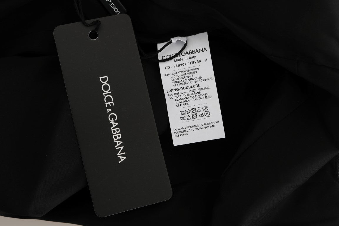 A black tag on a gray polka dotted sheath wool dress from Dolce & Gabbana