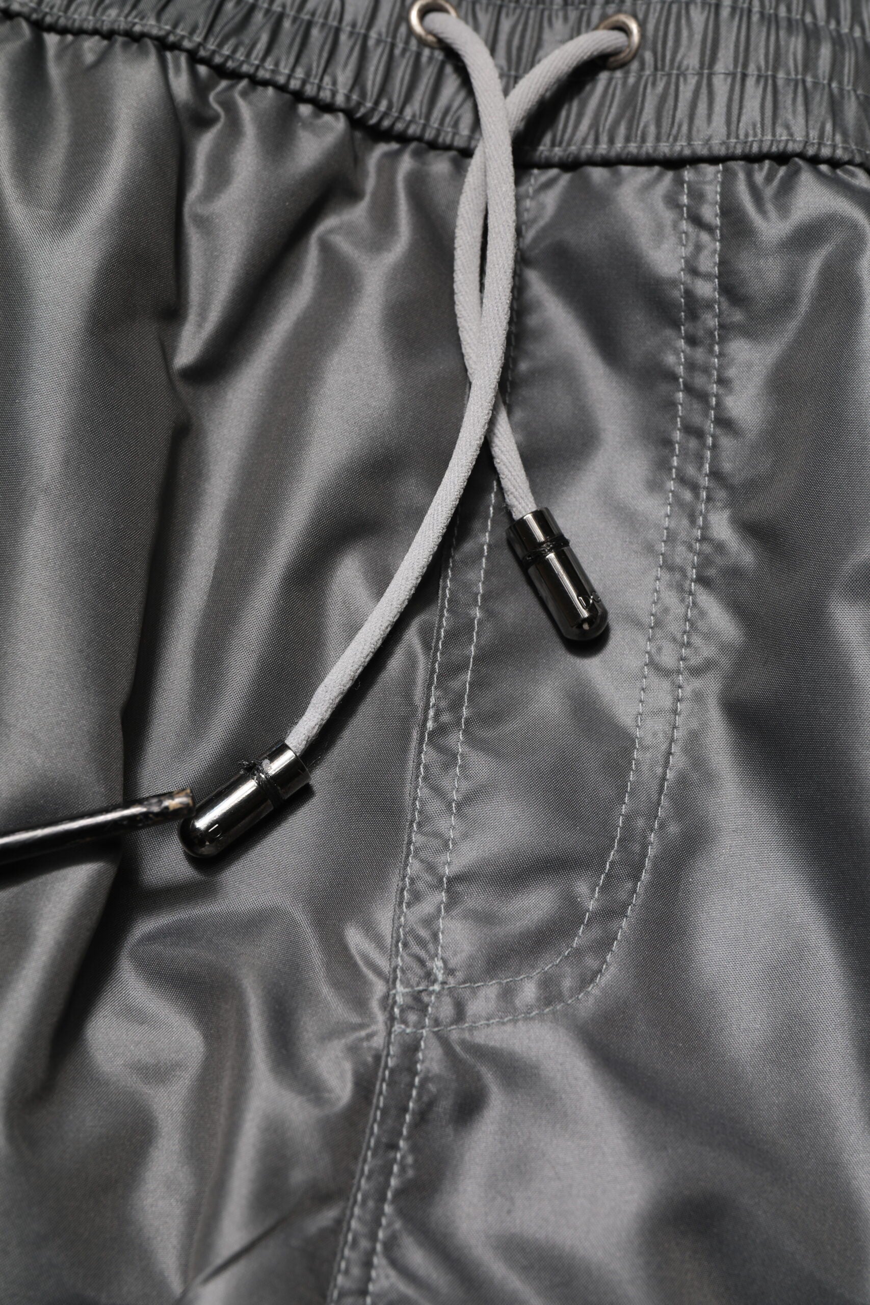 Grey athletic pants with drawstring waistband