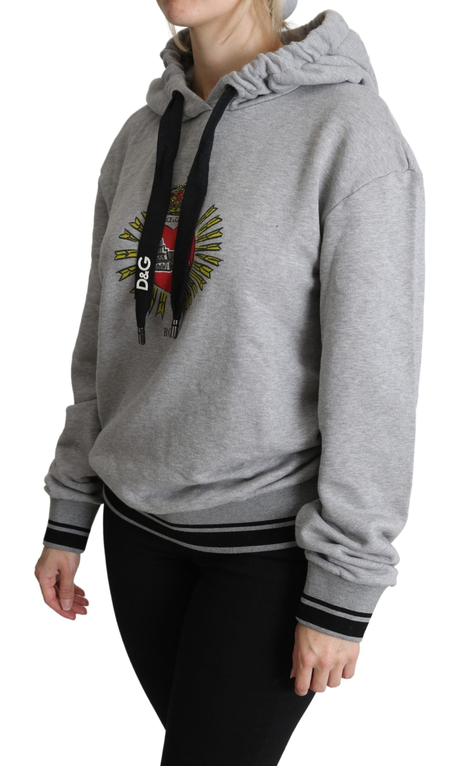 Woman wearing gray hoodie with graphic on front