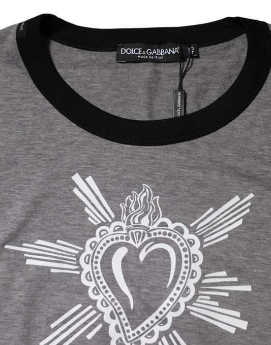 The shirt is gray with a heart design on the front