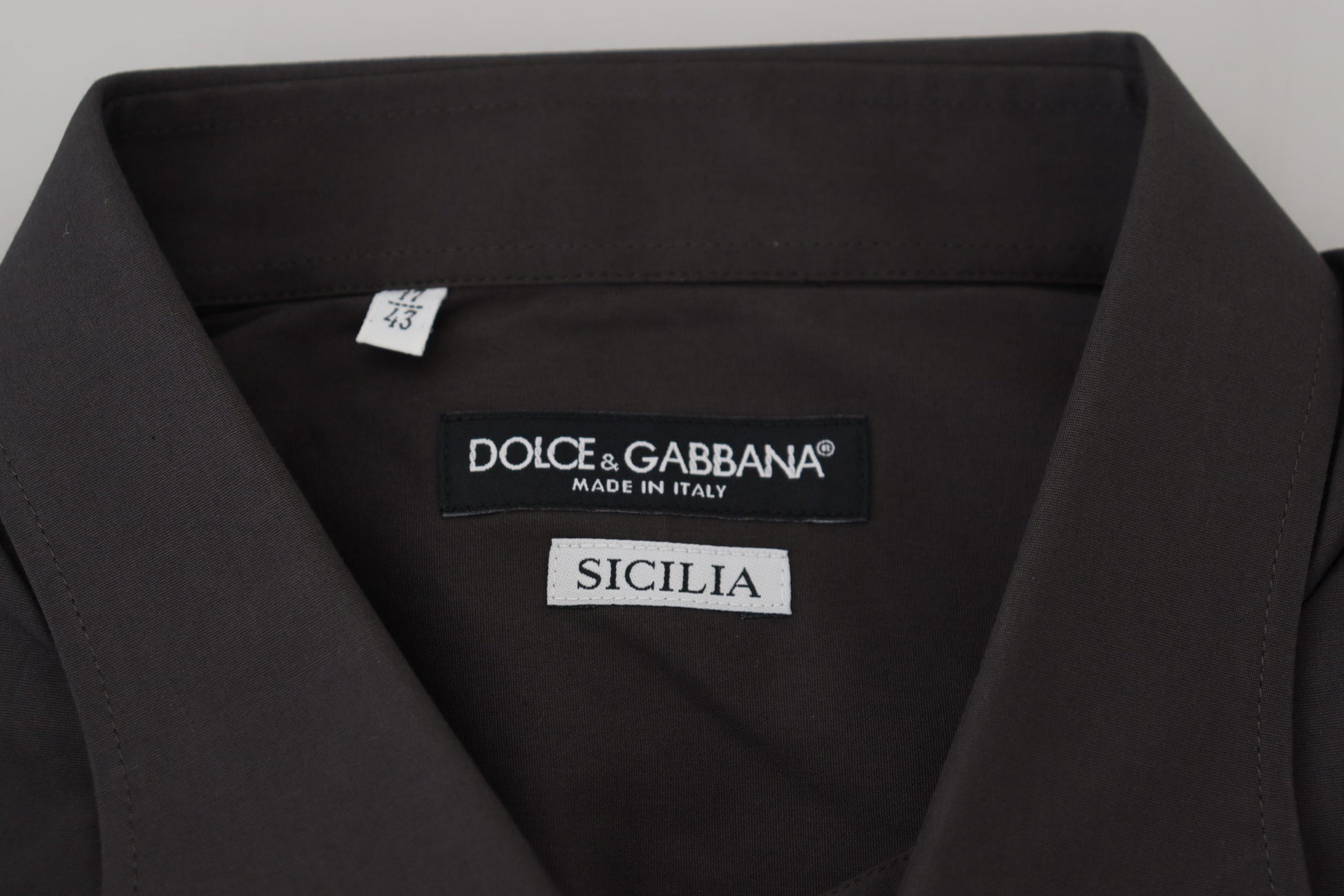 A gray dress shirt from Dolce & Gabbana with the Sicilia label