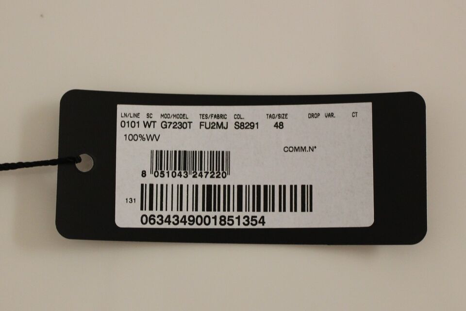 A black tag with white text and a barcode, attached to a gray slim fit button front dress