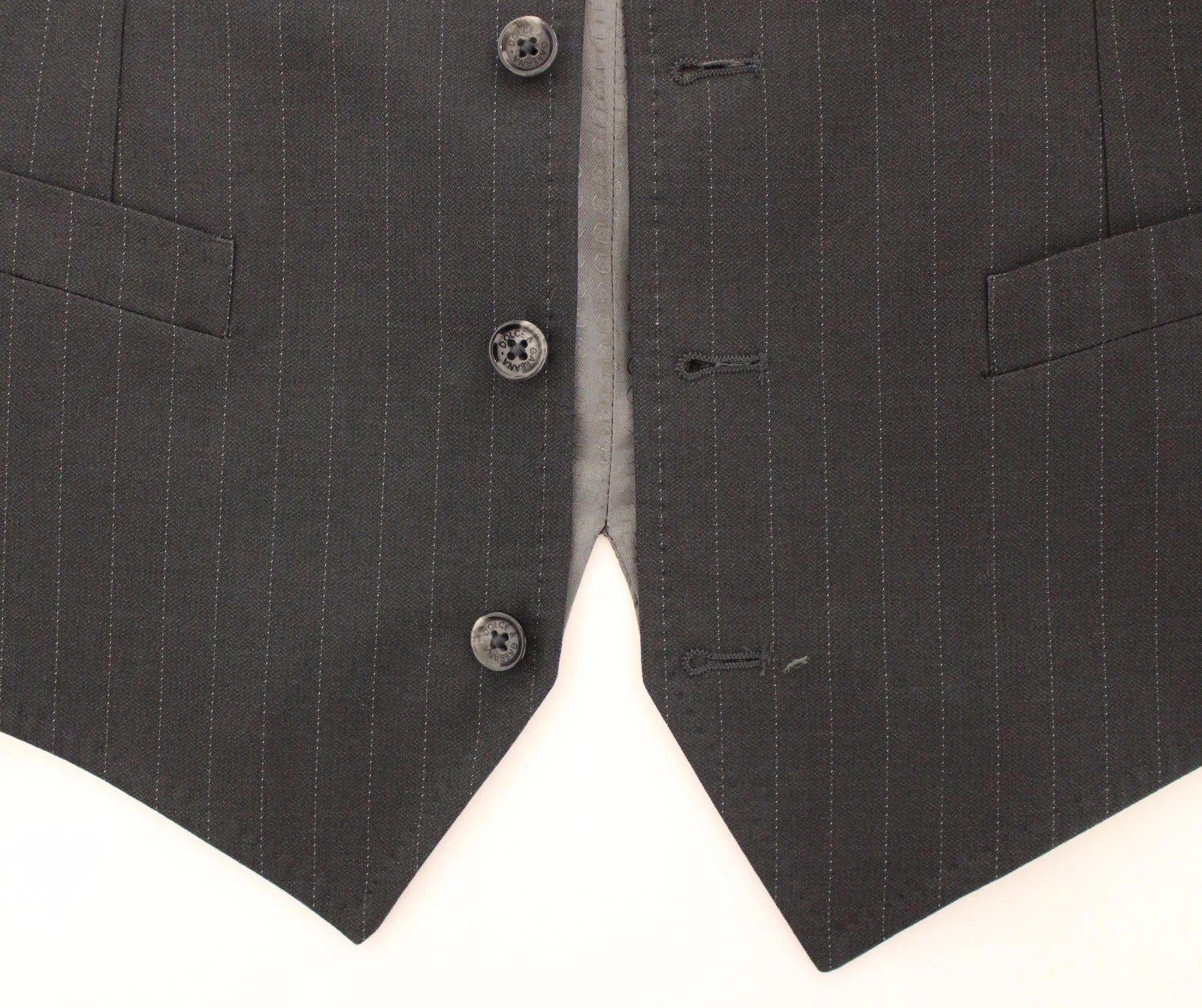 A gray striped vest with black buttons and a lapel collar