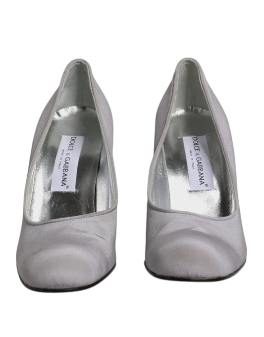 Silver high heel shoes with a label on the inside