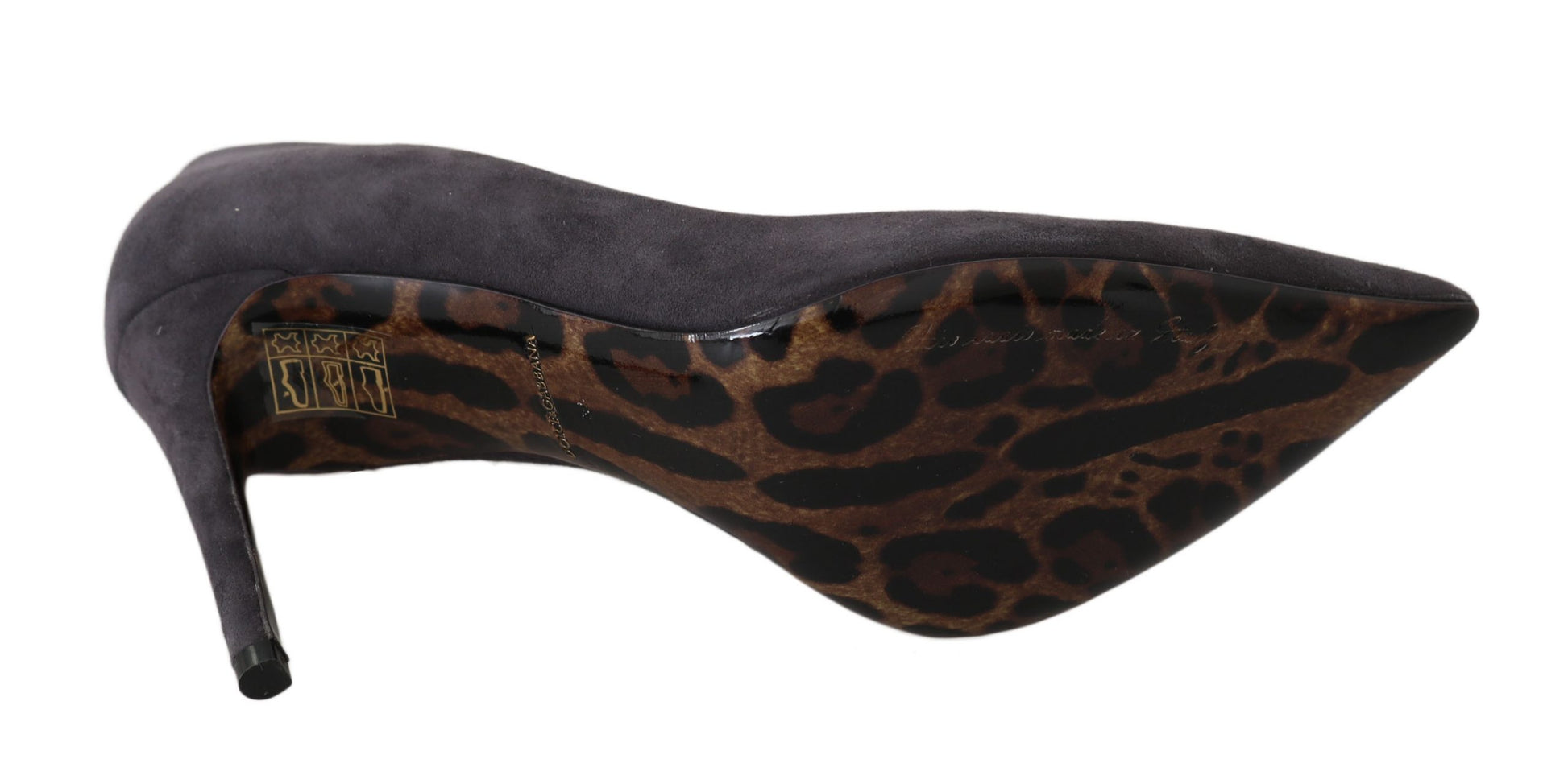 A single shoe against a neutral background. It is a women's high heel shoe with a pointed toe and a stiletto heel. The up