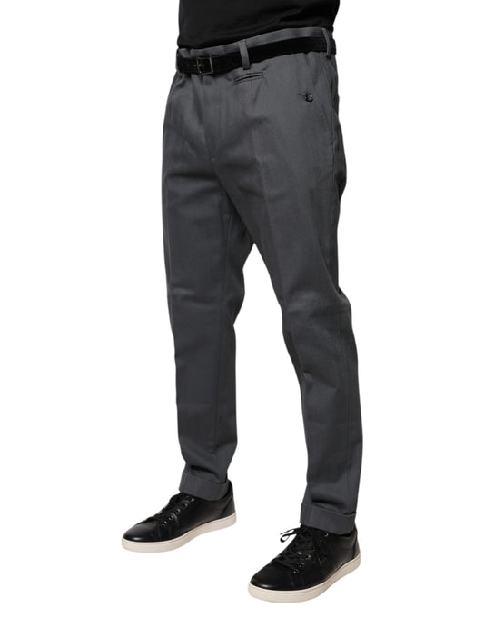 Man wearing gray pants and black shoes