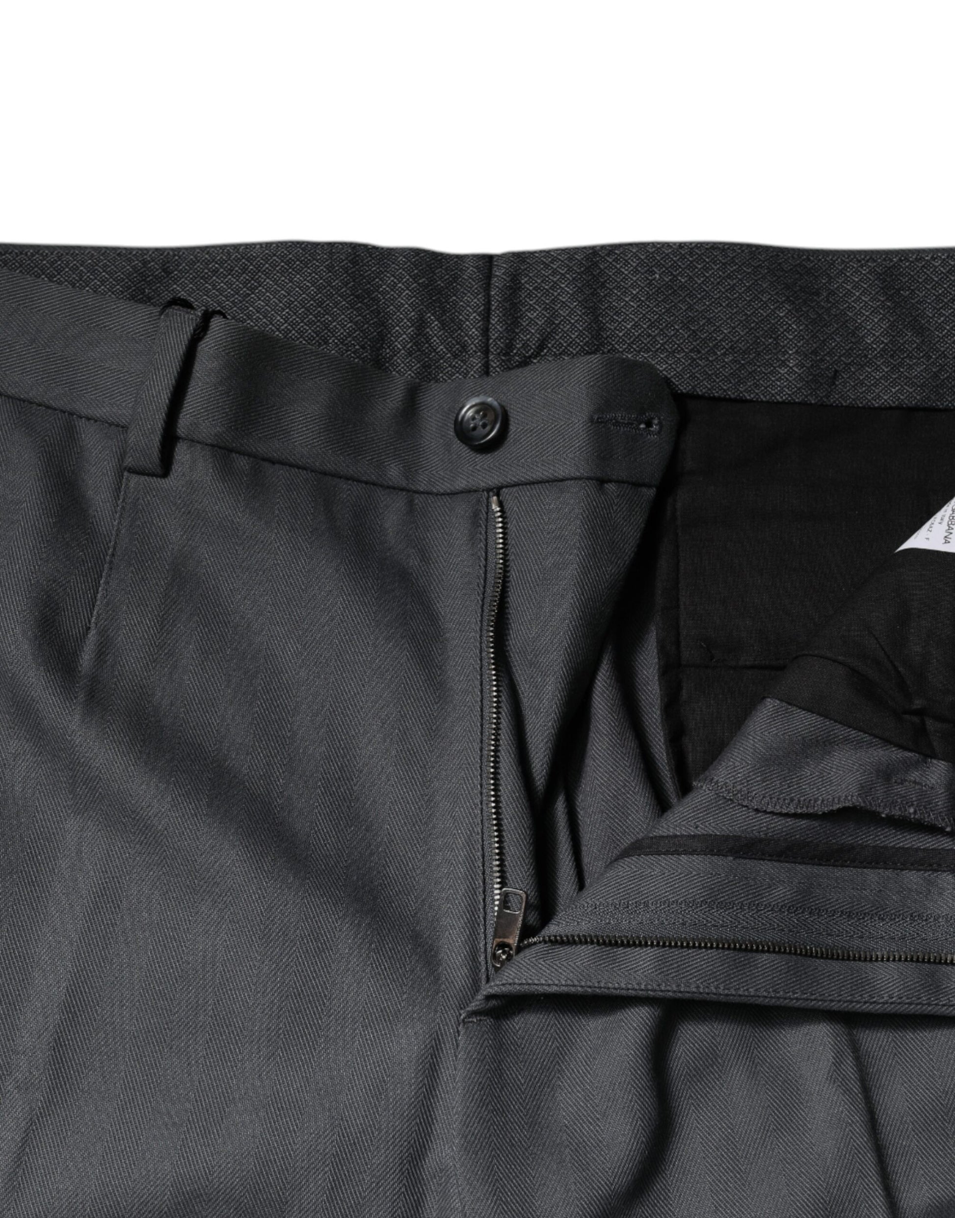 Pair of dark blue trousers with zippered pockets on sides