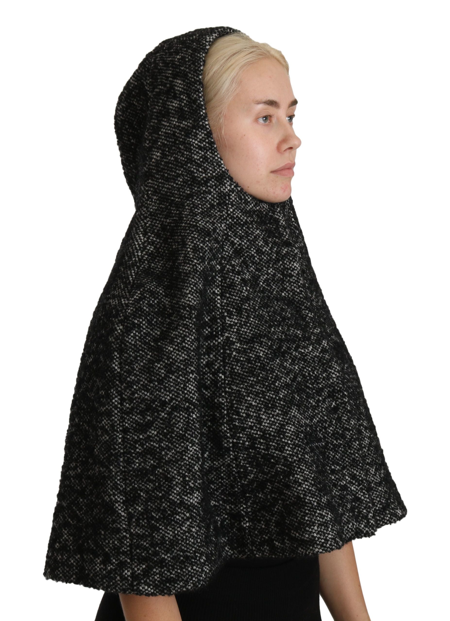 Black head covering worn by woman