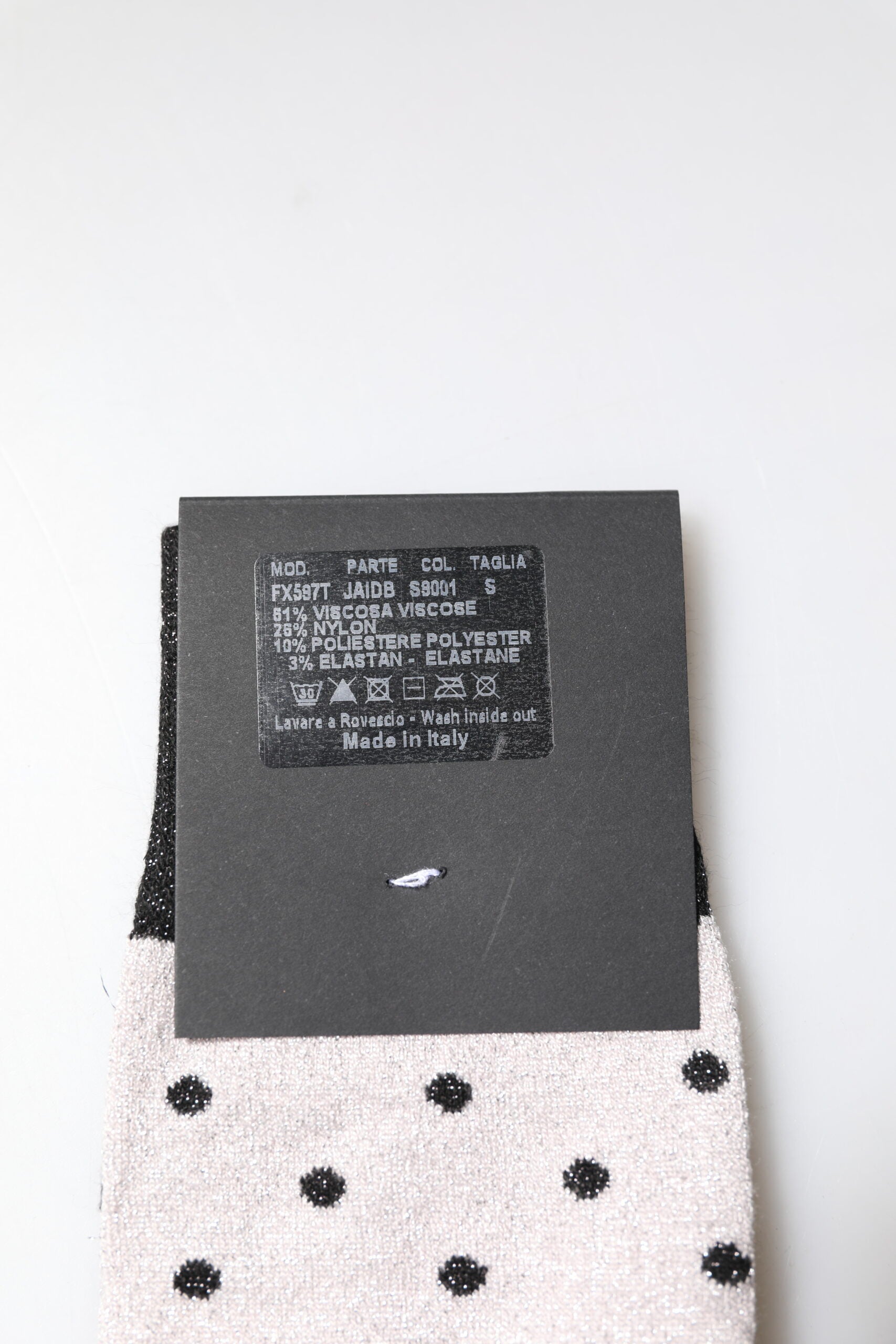 Pair of socks with black writing on them