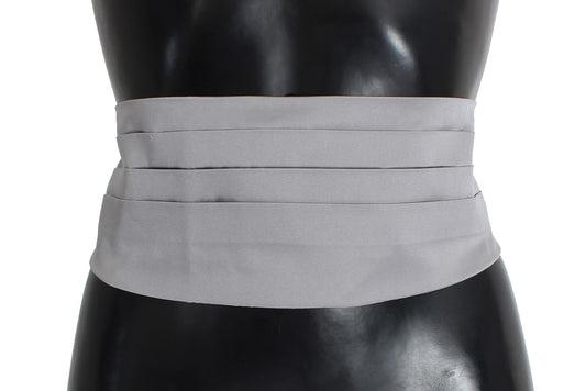A black mannequin torso wearing a grey corset or waist cincher
