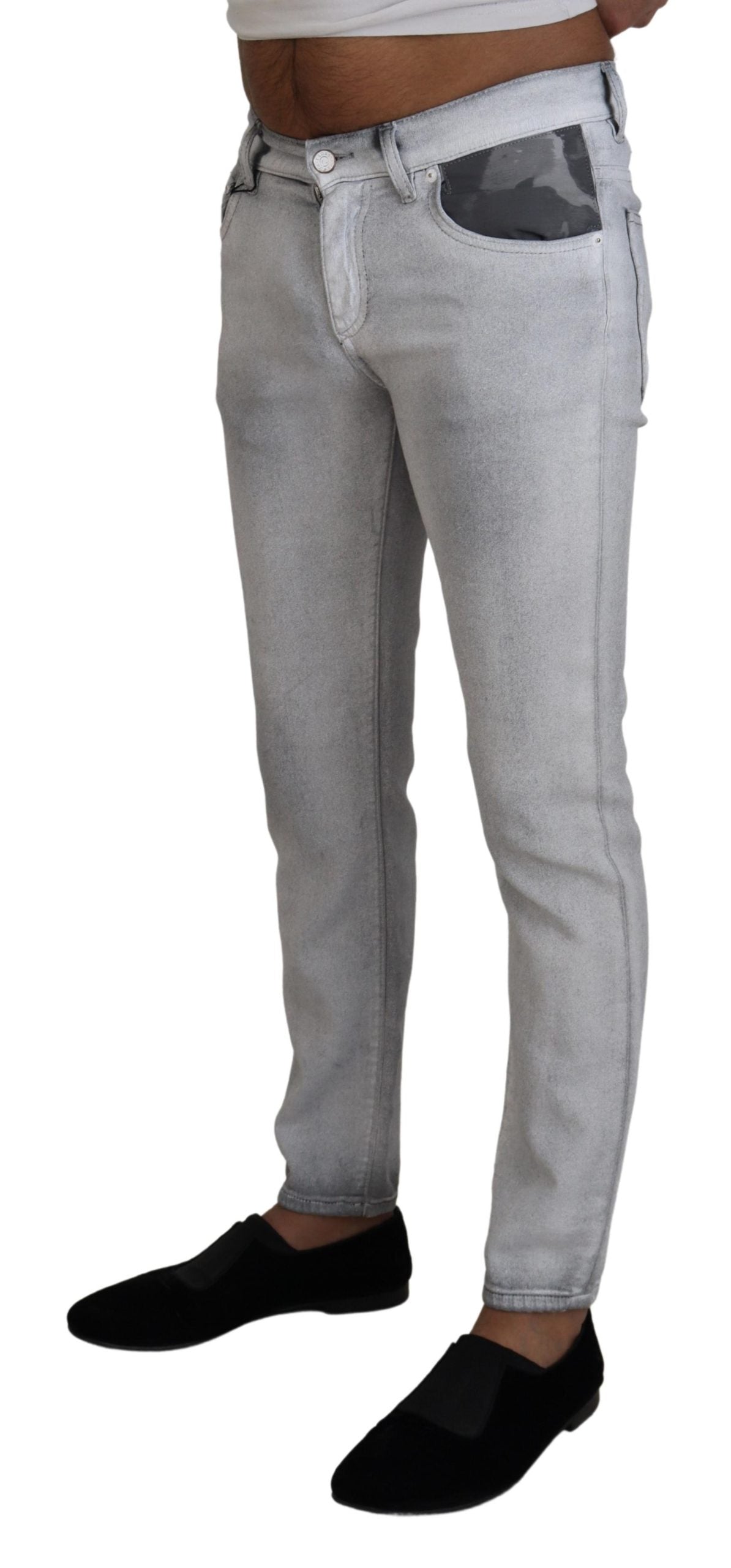 Man wearing blue jeans and black shoes