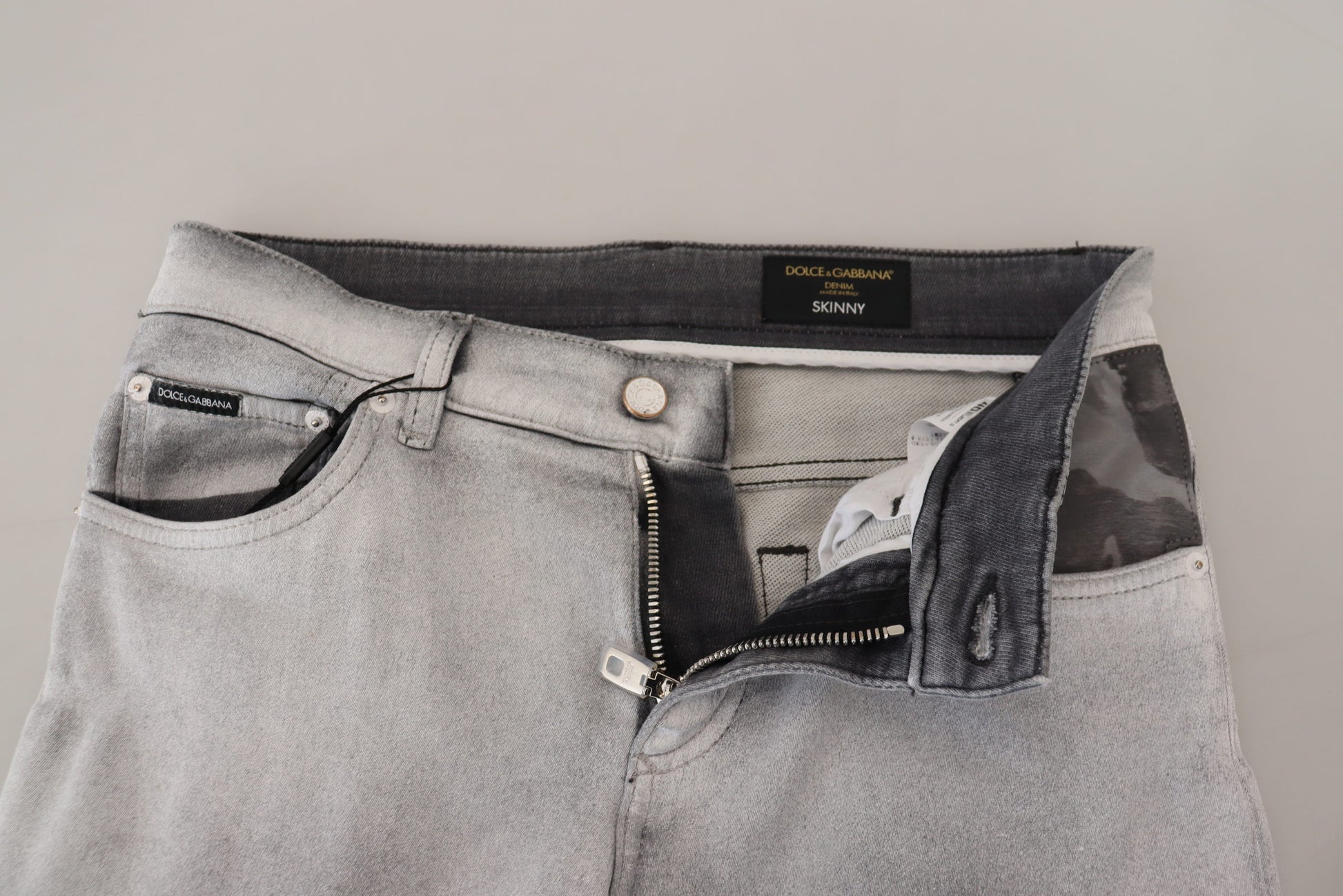 Pair of light blue jeans on a hanger