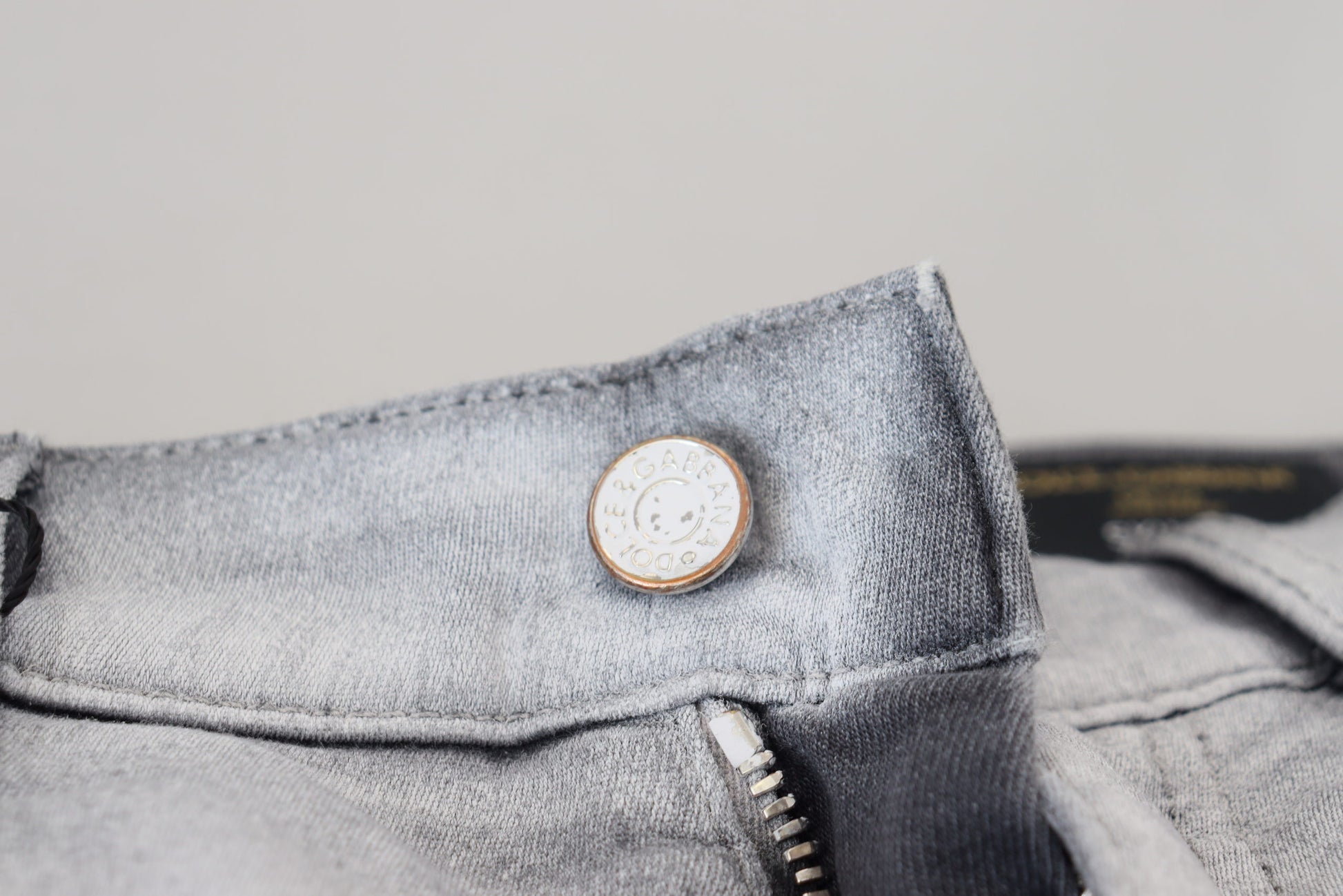 Blue denim jeans with button closure