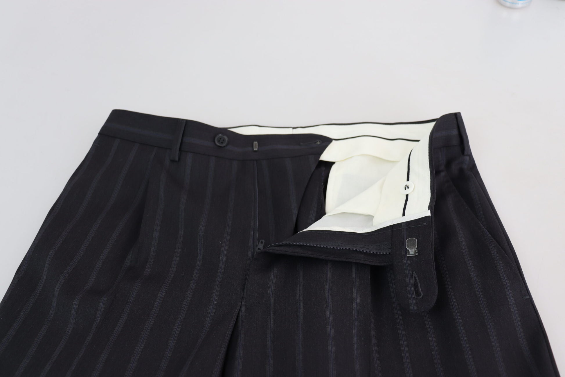 Pair of black pants with a white label on the waistband