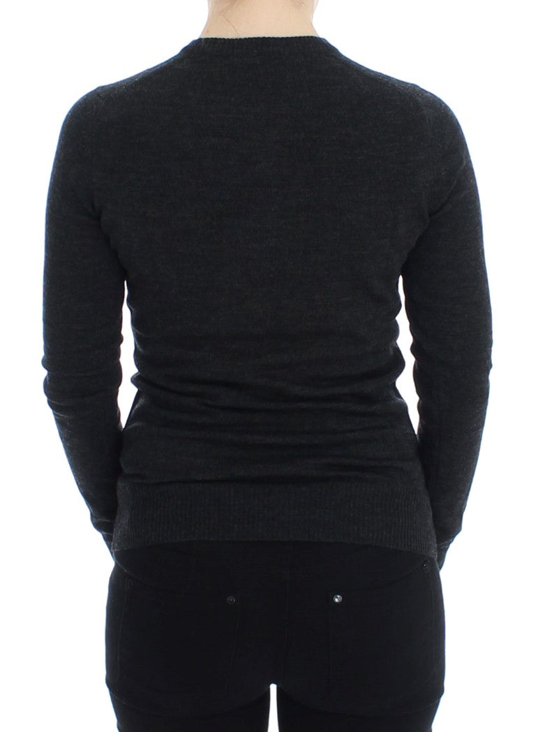 Black long sleeve sweater on a mannequin