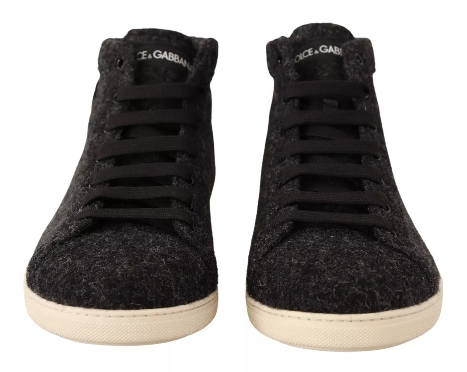 Pair of black sneakers with white soles