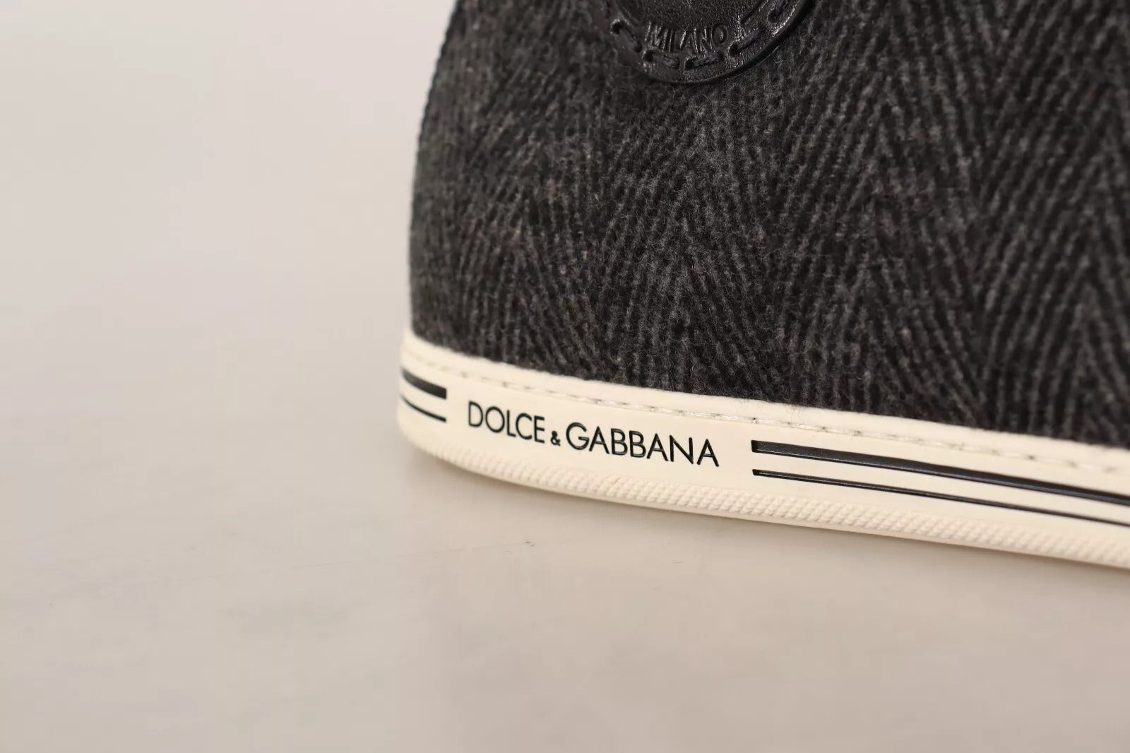 The shoe is gray with a white sole