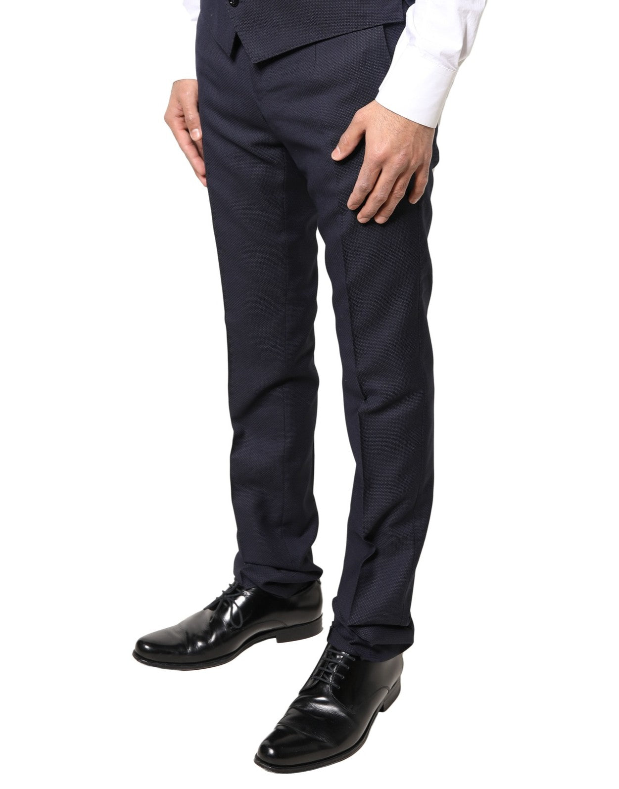 A pair of men's trousers from the brand Dolce & Gabbana. They are made of gray wool and feature a patterned d