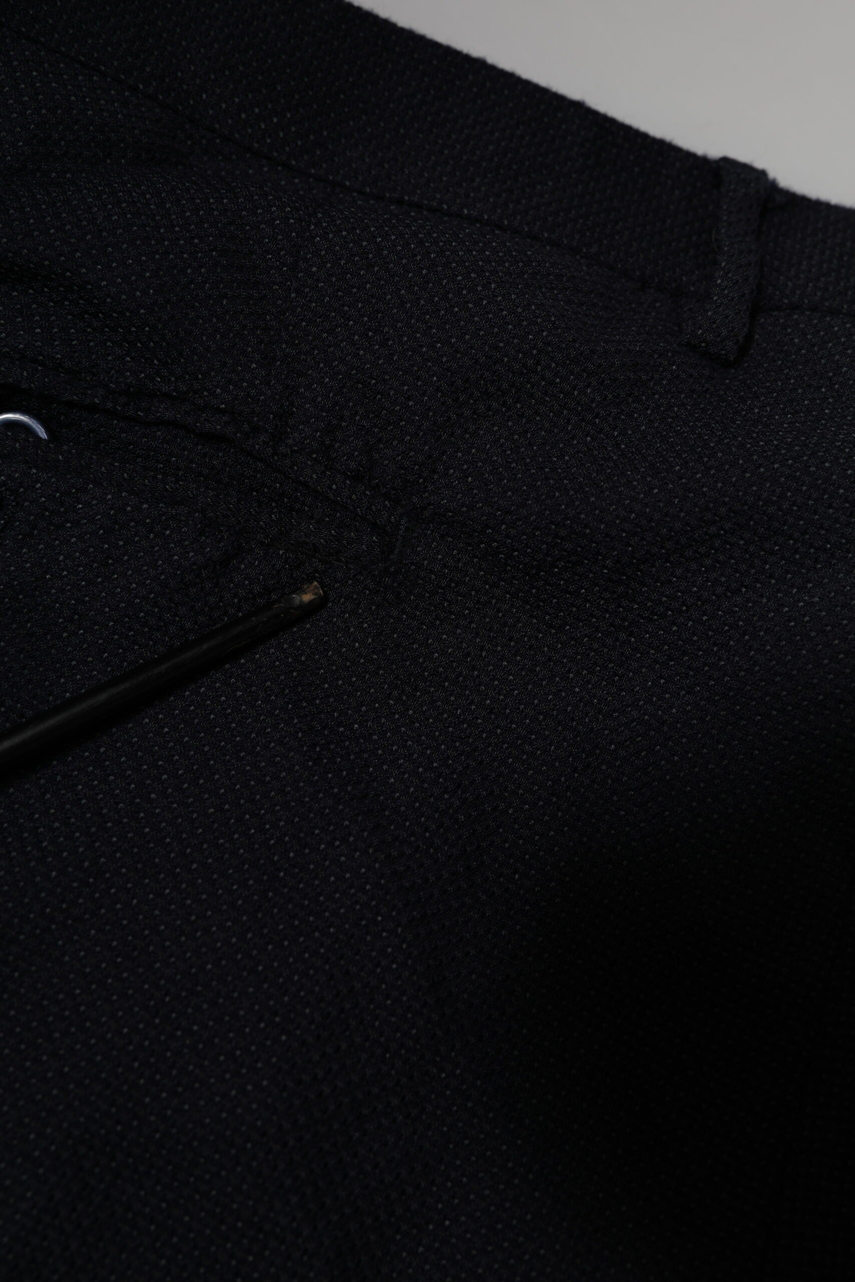 A pair of gray wool formal dress pants from the brand Dolce & Gabbana. They are designed for men and feature