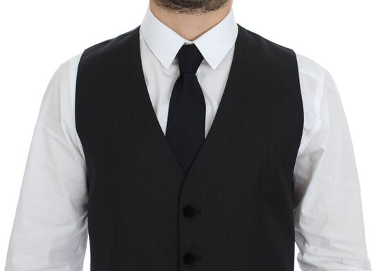 A gray wool vest with black buttons and a tie, part of a formal dress ensemble